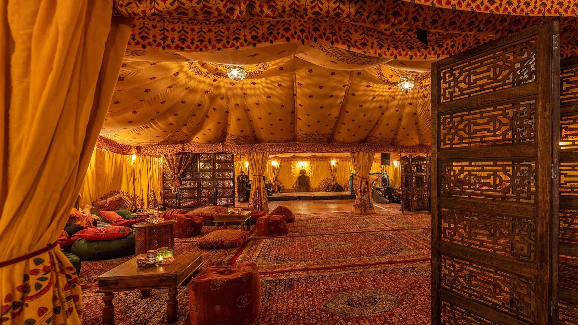 An Arabian tent with hand block printed Saffron linings